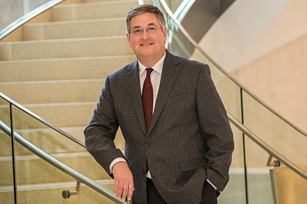 Image of one person standing on a stairwell